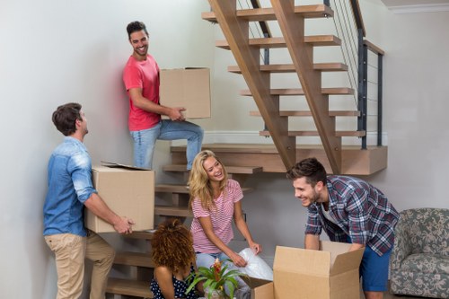Flat removals planning in Canningtown with packed boxes and moving supplies