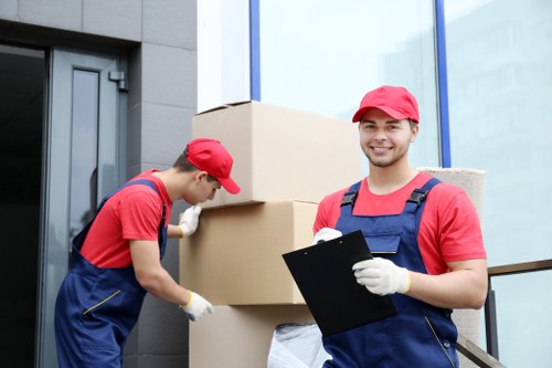 Staff and customers moving stored items safely at Canningtown Storage